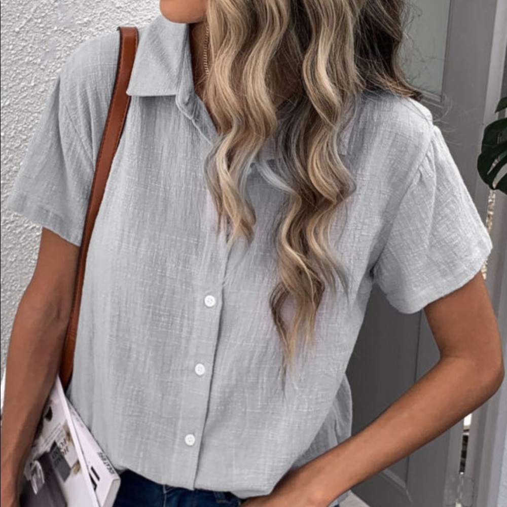 The grey skies button up!